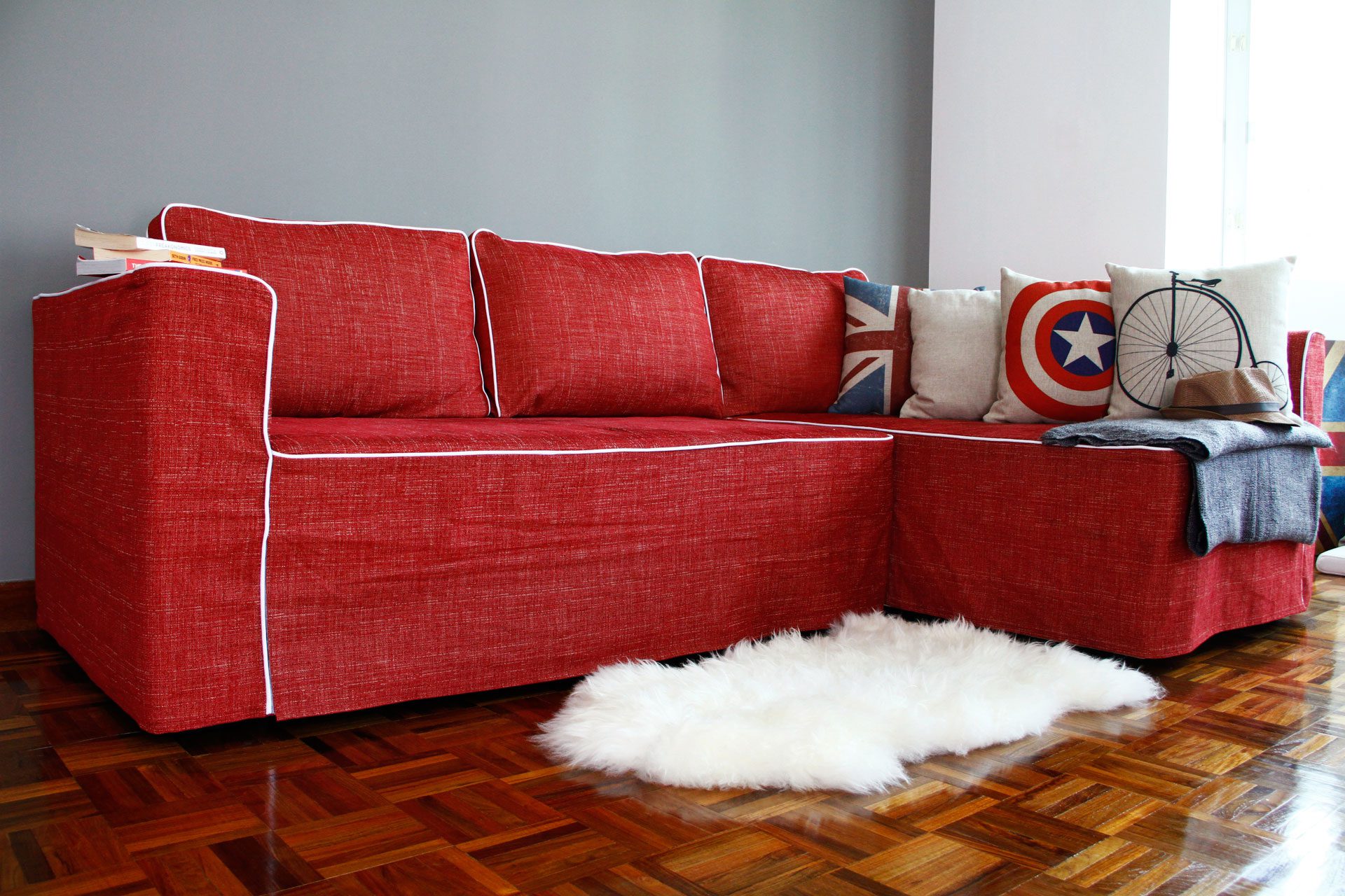 IKEA Manstad Sofa with slipcover from Comfort Works with Nomad Red fabric customized with white contrast piping