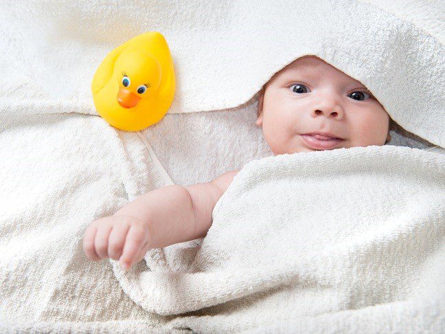 baby with rubber duck