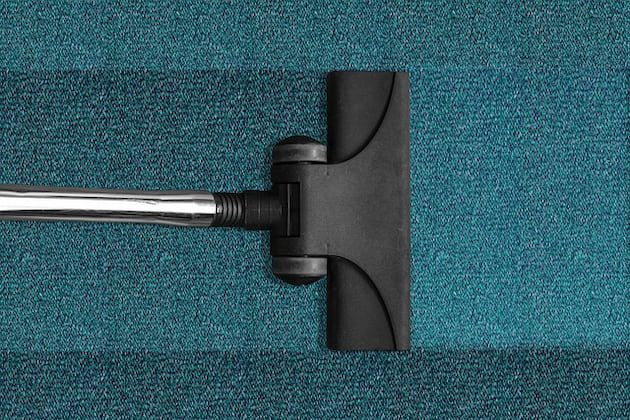 vacuum cleaner on blue carpet