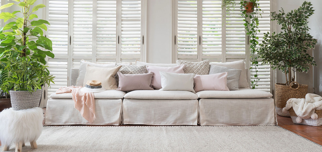 white linen sofa covers in a white living room