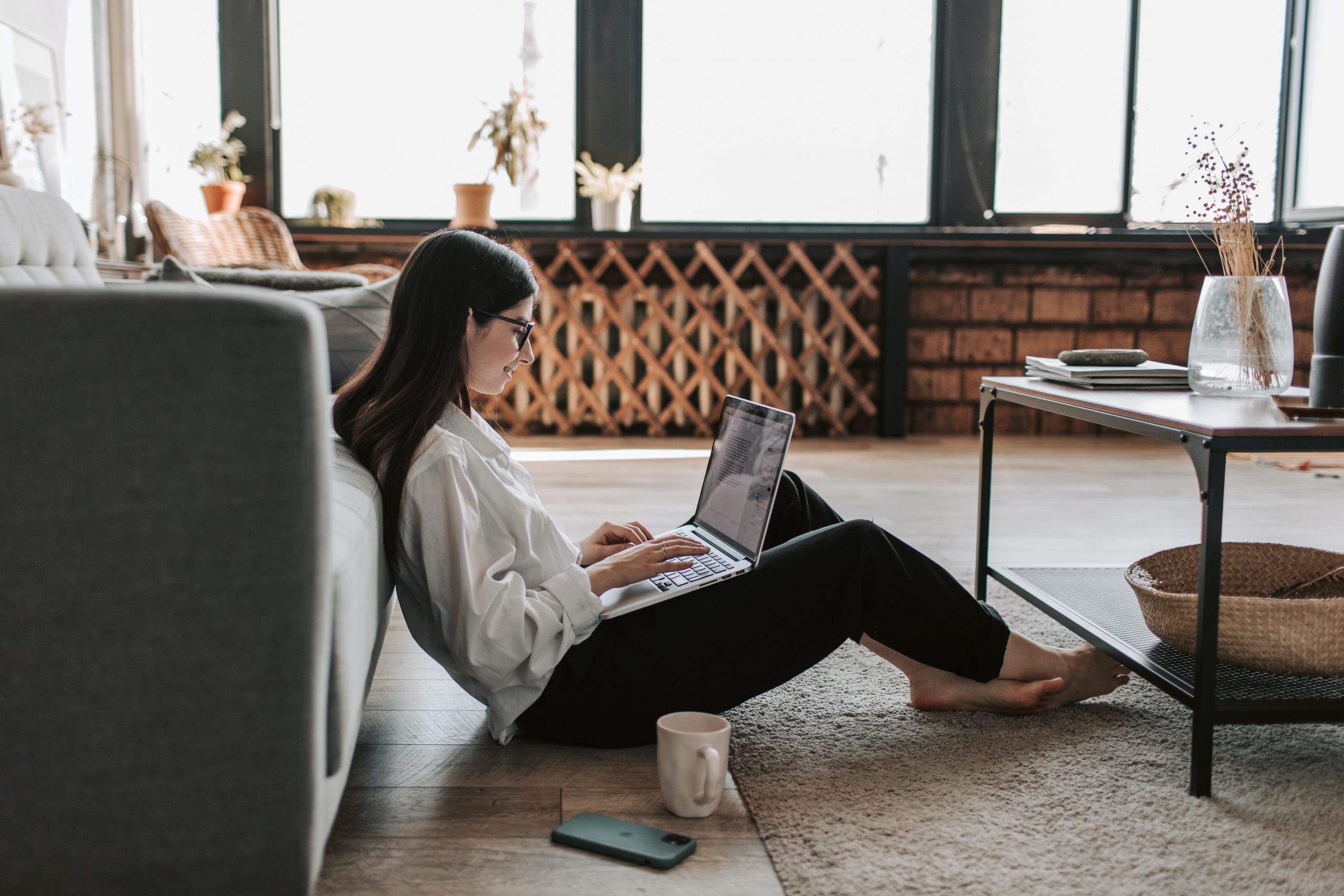 Lady sitting on floor with laptop