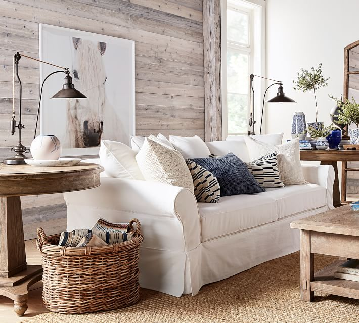 White potterybarn sofa slipcovered in white in a farmhouse living room