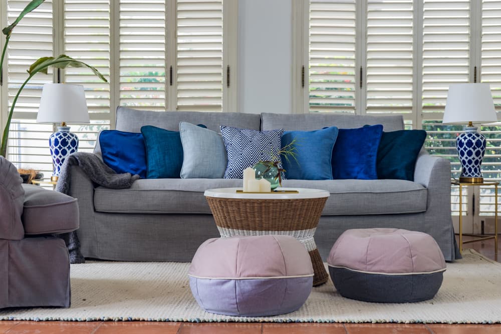 IKEA Farlov sofa in grey slipcovers in living room with coffee table and bean bags