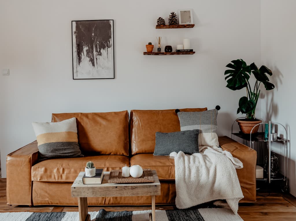 IKEA Kivik sofa in brown bycast leather slipcovers in living room