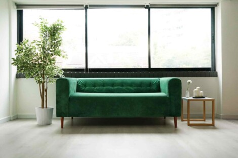 Klippan Loveseat in green velvet slipcovers and a tufted backrest