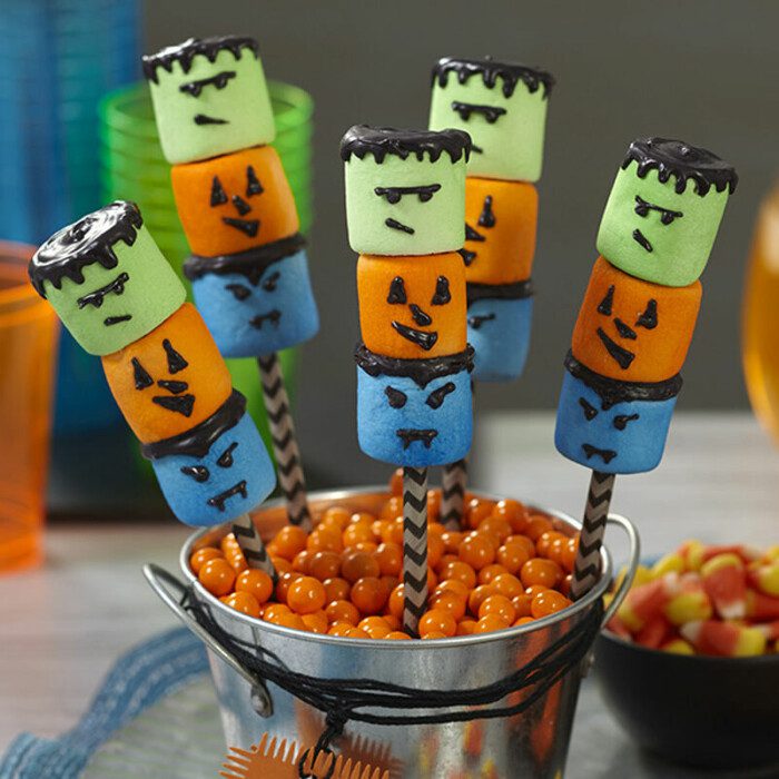 Marshmallows decorated to look like cute Halloween monsters