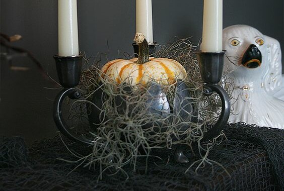 dark medieval style candles with pumpkin halloween decor idea