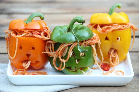 Pasta-stuffed carved peppers that look like evil rotten Jack-O-Lanterns