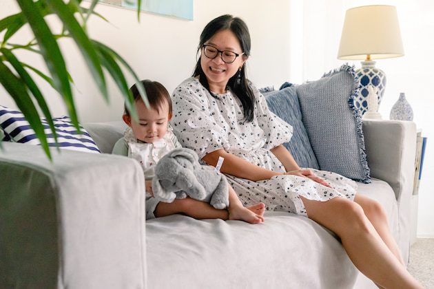 mother and child on grey IKEA sofa