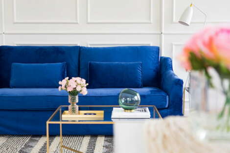 A blue couch in a living room