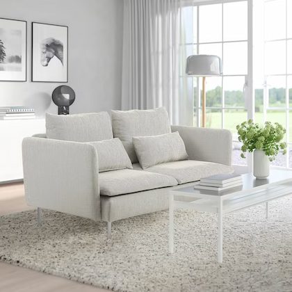 Light grey sofa in a living room. 