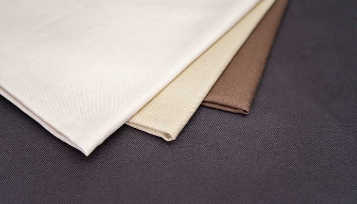 Fabrics laid out on surface