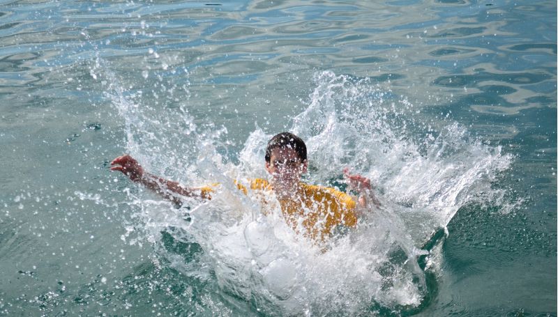 boy-in-water-fourth-of-july-pool-splash-party