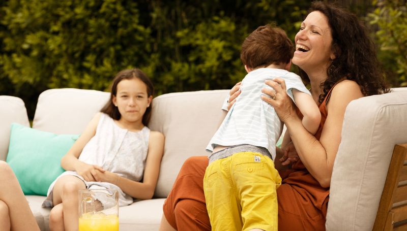 family-laughing-sunbrella-canvas-flax-outdoor-cushion-cover-summer