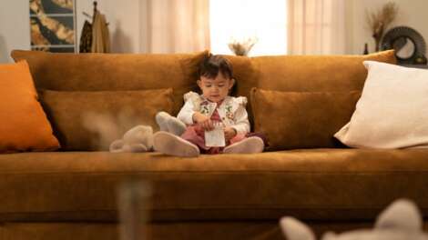 girl-sitting-on-sofa