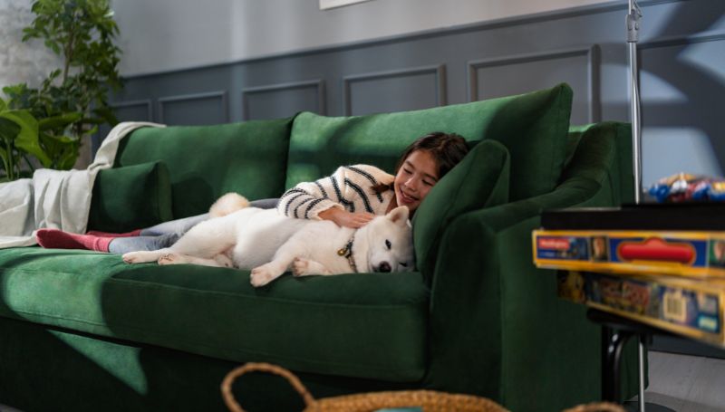 girl-dog-on-green-couch-winter-home-decor